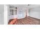 Spacious living room features light wood floors and whitewashed brick fireplace with shelves at 6513 Old Post Rd, Charlotte, NC 28212