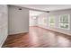 Bright living room with wood floors, neutral paint, and lots of natural light at 6513 Old Post Rd, Charlotte, NC 28212