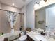 Bathroom featuring a shower-tub combo with floral shower curtain and granite topped vanity at 7337 Overjoyed Xing, Charlotte, NC 28215