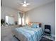 Bright bedroom with coastal-themed decor, light grey walls, and an accent window that brings in lots of light at 7337 Overjoyed Xing, Charlotte, NC 28215