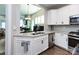 Modern kitchen featuring stainless steel appliances, granite countertops, and white cabinetry at 7337 Overjoyed Xing, Charlotte, NC 28215