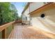 Spacious wooden deck extending from a two-story home with mature landscaping at 7407 Limerick Dr, Charlotte, NC 28270