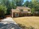 Lovely home with mature landscaping, brick accents, a long driveway and a chimney at 7407 Limerick Dr, Charlotte, NC 28270