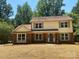 Beautiful front of home featuring brick accents, green shutters, and mature trees at 7407 Limerick Dr, Charlotte, NC 28270