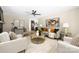 Bright living room features modern ceiling fan, neutral walls, and stylish decor at 7407 Limerick Dr, Charlotte, NC 28270