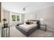 Main bedroom suite with plush carpet, natural light, and stylish decor at 7407 Limerick Dr, Charlotte, NC 28270