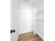 Walk-in closet with hardwood flooring, shelving, and blank canvas at 7407 Limerick Dr, Charlotte, NC 28270