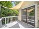 Relaxing deck with shade sail, tile flooring, and sliding glass door at 7434 Lawyers Station Dr, Mint Hill, NC 28227