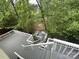 Multi-level backyard deck surrounded by lush greenery and providing outdoor living space at 7434 Lawyers Station Dr, Mint Hill, NC 28227