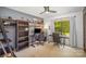 Office space with a built-in bookshelf, desk, and a window offering outdoor views at 7434 Lawyers Station Dr, Mint Hill, NC 28227