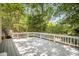 Spacious backyard deck perfect for entertaining with mature trees and natural shade at 7434 Lawyers Station Dr, Mint Hill, NC 28227