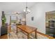 Open dining area with hardwood floors, chandelier, and view to living room and kitchen for easy entertaining at 7434 Lawyers Station Dr, Mint Hill, NC 28227