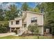 Charming two-story home with attached garage and a neatly landscaped front yard surrounded by mature trees at 7434 Lawyers Station Dr, Mint Hill, NC 28227