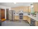 Bright kitchen with stainless steel appliances, tile backsplash and spacious countertop at 7434 Lawyers Station Dr, Mint Hill, NC 28227