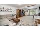 Bright living room with a sliding door to the deck and decor shelves at 7434 Lawyers Station Dr, Mint Hill, NC 28227