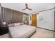 Main bedroom featuring a ceiling fan, natural light, and a decorative barn door entrance at 7434 Lawyers Station Dr, Mint Hill, NC 28227