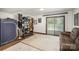 Organized storage space with shelving and access to the deck through a sliding glass door at 7434 Lawyers Station Dr, Mint Hill, NC 28227