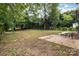 Spacious backyard offers plenty of room for recreation and relaxation at 8208 Doverdale Ln, Charlotte, NC 28217
