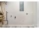 Unfinished basement with utility connections provides a blank canvas for customization at 8208 Doverdale Ln, Charlotte, NC 28217