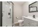 Stylish bathroom features a glass-enclosed shower, gray vanity and contemporary fixtures at 8208 Doverdale Ln, Charlotte, NC 28217