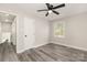 Inviting bedroom with a window providing natural light and a ceiling fan at 8208 Doverdale Ln, Charlotte, NC 28217