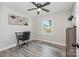 Comfortable bedroom has a modern ceiling fan and natural light at 8208 Doverdale Ln, Charlotte, NC 28217