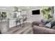 Open living space combines living and dining areas with hardwood floors and modern decor at 8208 Doverdale Ln, Charlotte, NC 28217