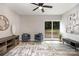 Stylish living room offers backyard views and plenty of natural light at 8208 Doverdale Ln, Charlotte, NC 28217