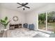 Cozy living room features natural light from sliding glass doors with backyard views at 8208 Doverdale Ln, Charlotte, NC 28217