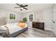Serene main bedroom featuring a plush bed, dark wood dresser, and natural light at 8208 Doverdale Ln, Charlotte, NC 28217