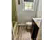 Functional bathroom with a tub/shower, window and modern vanity at 8417 Rolling Hills Ave, Hickory, NC 28602
