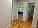 Hallway with hardwood floors and view of multiple rooms at 8417 Rolling Hills Ave, Hickory, NC 28602