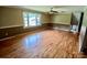 Bright living room featuring hardwood floors, wainscotting, and a large window with a view at 8417 Rolling Hills Ave, Hickory, NC 28602