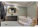 Bathroom showcasing a double sink vanity with a soaking tub at 10435 Silver Mine Rd, Fort Mill, SC 29707