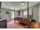 Bedroom featuring a four poster bed with gray walls and carpet and hanging chair at 10435 Silver Mine Rd, Fort Mill, SC 29707
