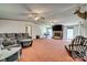 Spacious living room with a stone fireplace and a comfortable seating arrangement at 10435 Silver Mine Rd, Fort Mill, SC 29707