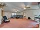 Expansive living room with plush seating, ceiling fans, and natural light at 10435 Silver Mine Rd, Fort Mill, SC 29707