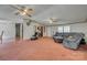 Large living room featuring comfortable seating, ceiling fans and easy access to other living areas at 10435 Silver Mine Rd, Fort Mill, SC 29707