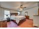 Spacious main bedroom includes a large bed and ceiling fan with good natural light at 10435 Silver Mine Rd, Fort Mill, SC 29707