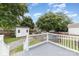 Backyard showing a shed, a gravel path, and a gray wooden deck with white railings at 105 Mcgill Nw Ave, Concord, NC 28025