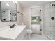 Bright bathroom featuring modern fixtures, updated mirror and vanity, and tiled shower for a luxurious feel at 105 Mcgill Nw Ave, Concord, NC 28025