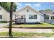 Charming single-Gathering home featuring white siding, a welcoming front porch, and a well-maintained yard at 105 Mcgill Nw Ave, Concord, NC 28025