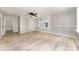 Bright living room featuring neutral paint, modern ceiling fan, and natural light pouring in from large windows at 105 Mcgill Nw Ave, Concord, NC 28025