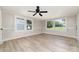 Spacious living room with large windows, modern ceiling fan, and stylish flooring perfect for entertaining at 105 Mcgill Nw Ave, Concord, NC 28025