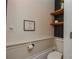 Cozy bathroom features wood shelving, modern fixtures, and charming wall decor at 1239 Mac Ln, Stanley, NC 28164
