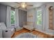 Bright Bedroom featuring a crib, rocker, and charming decor with natural light at 1239 Mac Ln, Stanley, NC 28164