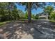 The home features a well-maintained gravel driveway and lush greenery at 1239 Mac Ln, Stanley, NC 28164