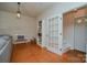 Charming hallway with a decorative light fixture and staircase to upper level at 1239 Mac Ln, Stanley, NC 28164