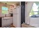 Bright kitchen featuring stainless steel appliances, farmhouse sink, and butcher block countertops at 1239 Mac Ln, Stanley, NC 28164