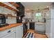 Charming kitchen with stainless steel appliances, butcher block countertops, and ample cabinet space at 1239 Mac Ln, Stanley, NC 28164